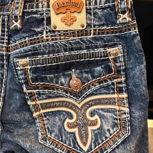 Rock Revival Distressed Blue Jeans with Orange Stitching